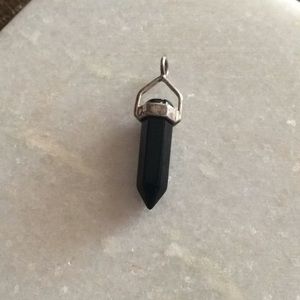 Sterling silver and onyx pendant.
